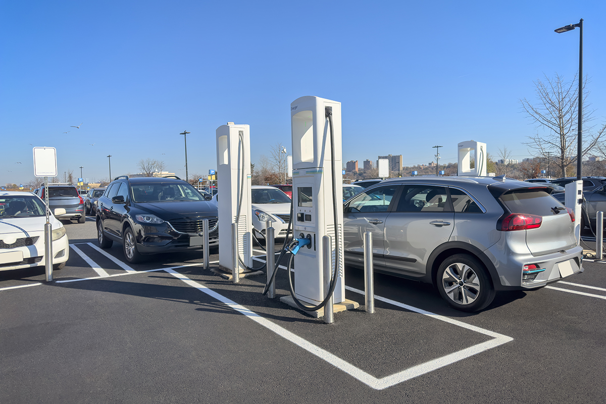 EVs in a parking lot charging image